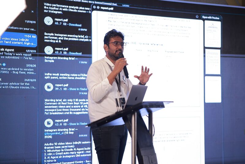 Nishanth S showing an AI-generated report on the big screen at Live Lab